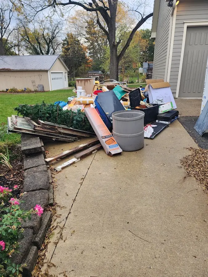 Dumpster being loaded with debris for 10 Yard Dumpster Rental in Prestonsburg